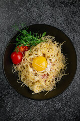 Canvas Print - Pasta carbonara with bacon and egg yolk
