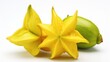 Carambola fruit on white background. Exotic yellow of carambola tree. Sweet healthy vegetarian dessert. Close up. Ideal for use in the food and drink industry, for tropical fruit presentations.