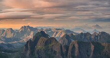 View over mountain tops and sea, mountains in evening light at sunset, from Hermannsdalstinden, Moskenesoey, Lofoten, Nordland, Norway, Europe