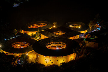 Tianluokeng Tulou cluster at night in the village of Tianluokeng, Fujian, China