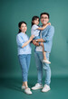 © Timeimage - Photo of young Asian family on background