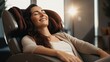 beautiful young woman relaxing on the massage chair.