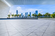 © ABCDstock - Empty square floors and city skyline with modern buildings scenery