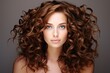 hairs curly beautiful woman coiffure beauty female portrait hair ringlet young face brunette style fashion model smooth gloss creative lying floor indoor head closeup pretty cute attractive adult