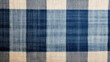 Background made of natural linen fabric in a checkered pattern.