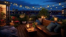Roof Terrace Of A Beautiful House With Night-time View Of The City. View Over Cozy Outdoor Terrace With Outdoor String Lights And Lanterns