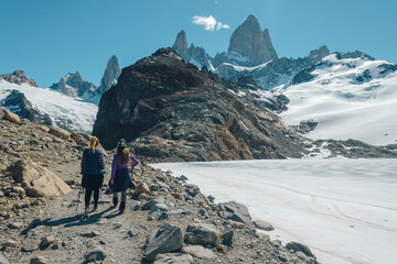 Wall Mural - two unrecognizable person walking in a path to go to fitzroy mountain