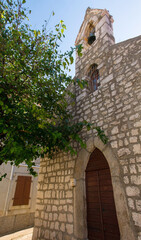 The gothic 15th century Church of the Holy Trinity in the Stari Grad historic centre of the coastal town of Novi Vinodolski, Primorje-Gorski Kotar County, Croatia. Called Crkva Sv Trojstva in Croatian