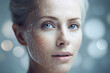 A woman's head with glowing neurons on one side of her face against a blue background. Radiant energy on the face.  Beauty concept skin aging. anti-aging procedures, rejuvenation, lifting, tightening 