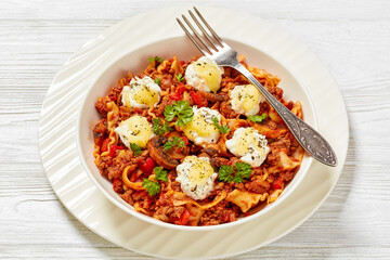 Wall Mural - Lasagnette with ground beef in bowl, top view