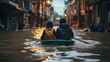 Two people paddling in a kayak on a flooded city street