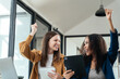© NINENII - International team of business women creative businesspeople coworker in office Happy to be successful partnership teamwork success concept.