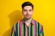 Portrait of handsome businessman dont care his bristle wearing striped glamour shirt for special event isolated on yellow color background