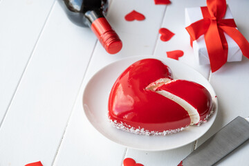 Wall Mural - heart shaped glazed valentine cake and flowers on wooden table