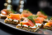Delicious Canapes With Smoked Salmon And Dill On The Plate Close Up