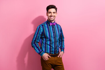 Poster - Photo of charismatic cheerful classy man beaming smile put arms pockets posing isolated on pink color background