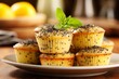 Delicious lemon poppy seed muffins on blurred kitchen background with space for text placement