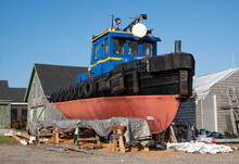 Old Tugboat Under Repair:  A Well-preserved Tugboat Awaits Further Restoration At A New England Shipyard.
