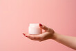 © Oksana - Female hands holding jar of cosmetic cream Cosmetic beauty product branding mockup