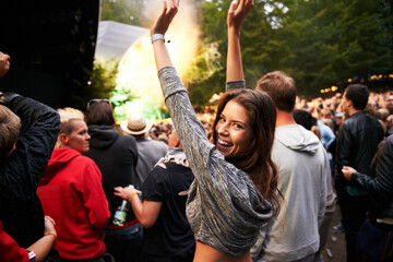 Poster - Happy woman, portrait and crowd in music festival for party, event or DJ concert in nature. Excited female person smile with hands up and audience at carnival, performance or summer fest outside