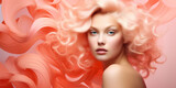 A naked woman model staring at the camera with shoulder length curly peach fuzz and pink color hair. Color of the 2024 year. Pink and orange wavy fabric background. Copy space.