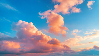 Poster - Beautiful natural background with blue sky and pink fluffy clouds at sunset