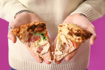 Sticker - Handsome tattooed young man with slices of tasty pizza on purple background, closeup