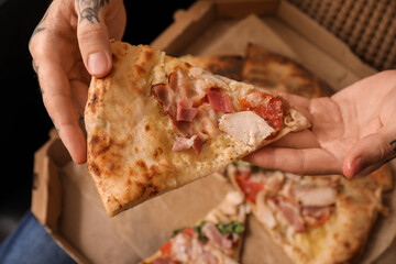 Sticker - Male hands with tasty pizza at home, closeup