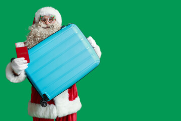 Wall Mural - Santa Claus with suitcase, passport and ticket on green background. Christmas vacation concept