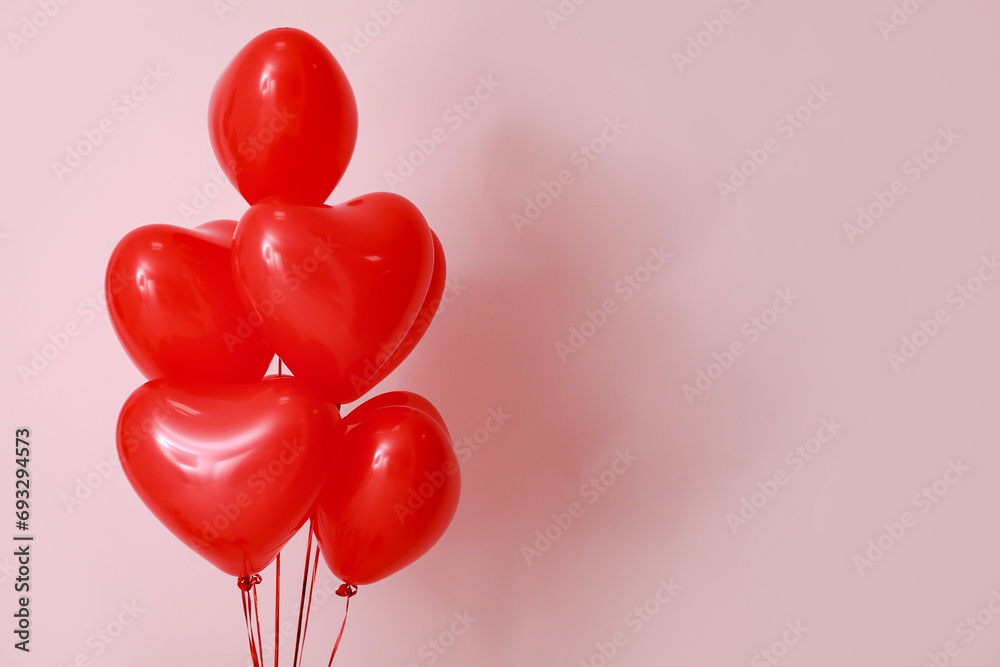 Heart shaped air balloons on pink background. Valentine's day celebration