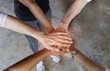 © SASITHORN - The hands team together with a partnership team Joining trust and successful Concept