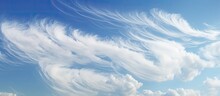 Latin Name For Curly Hooked Cirrus Clouds Is Cirrus Uncinus.