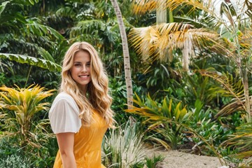 young adult woman with long hairstyle, blond , in the tropics, palm trees beauty, nature or vacation