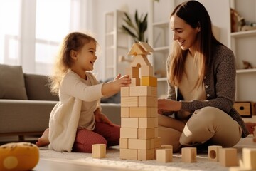 Poster - A woman and a little girl are seen playing with wooden blocks. This versatile image can be used to depict family bonding, educational activities, or creative playtime