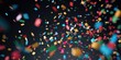 Colorful confetti scattered on a black background. Perfect for celebrations and parties