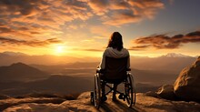A Person In A Wheelchair Looking At The Sunset