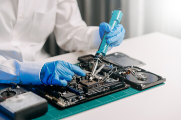 Wall Mural - The technician is putting the CPU on the socket of the computer motherboard. electronic engineering electronic repair, electronics measuring and testing, repair..