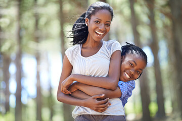 Wall Mural - Portrait, mother and son hiking in the forest together as a black family for travel, freedom or adventure. Love, smile or hug with a happy young woman and excited boy child in the woods for bonding