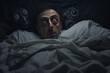 The concept of a nightmare, a person in bed surrounded by an ominous atmosphere