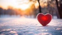 Single Red Heart In Snowy Landscape At Sunset