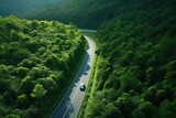 Fototapeta Na ścianę - Aerial view of highway in the forest. Top view from drone.