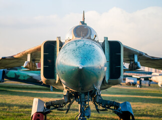 Wall Mural - old army military combat fighter aircraft at the airport