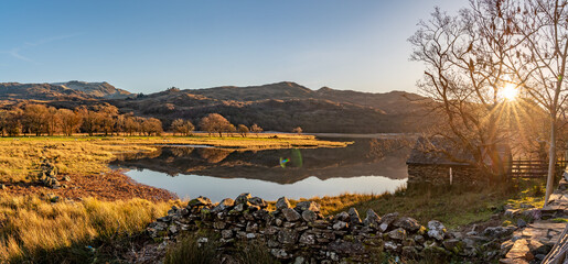 Wall Mural - Reflection views around Snowdonia lakes in winter