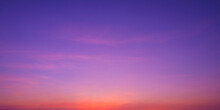 Colorful Romantic Twilight Sky With Beautiful Pink Sunset Cloud And Orange Sunlight On Dark Blue Sky After Sundown In Evening Time, Idyllic Peaceful Nature Panoramic Background