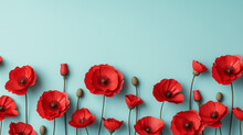 Red Poppy Flowers On A Light Blue Background