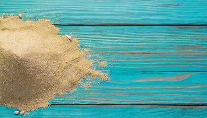 Poster - sea sand on blue wooden floor top view with copy space