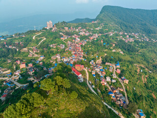 Wall Mural - Aerial view of Bandipur from Thani mai temple hill. Nepal. Main street with shops and commercial activities
