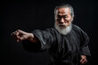 Mature martial art fighter master on black background. Generative AI