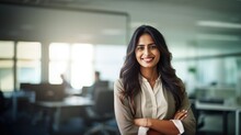 Portrait Of Indian Businesswoman Wearing Shirt And Standing Outside Conference Room. Portrait Of Happy Business Lady Wearing Spectacles And Looking At Camera With Copy Space. Satisfied Proud Female.
