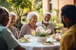 © Vorda Berge - Group of Happy Senior Friends Enjoying Meal Together